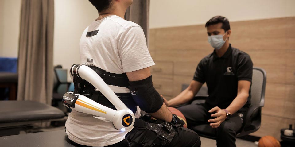 Therapist demonstrating equipment use